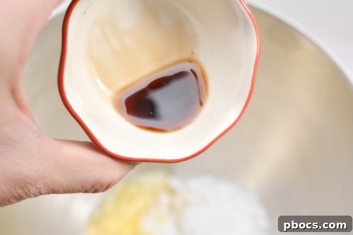 Delicious Keto Strawberry Mini Pies 9 Pressing crumbly almond flour mixture into mini pie tins