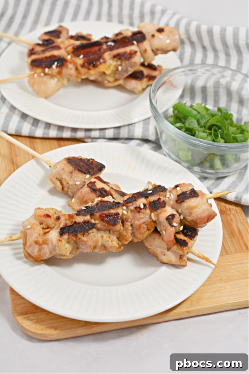 Sticky Keto Chicken Yakitori Skewers 6 A close-up of grilled Keto Chicken Yakitori Skewers, highlighting the crisp edges
