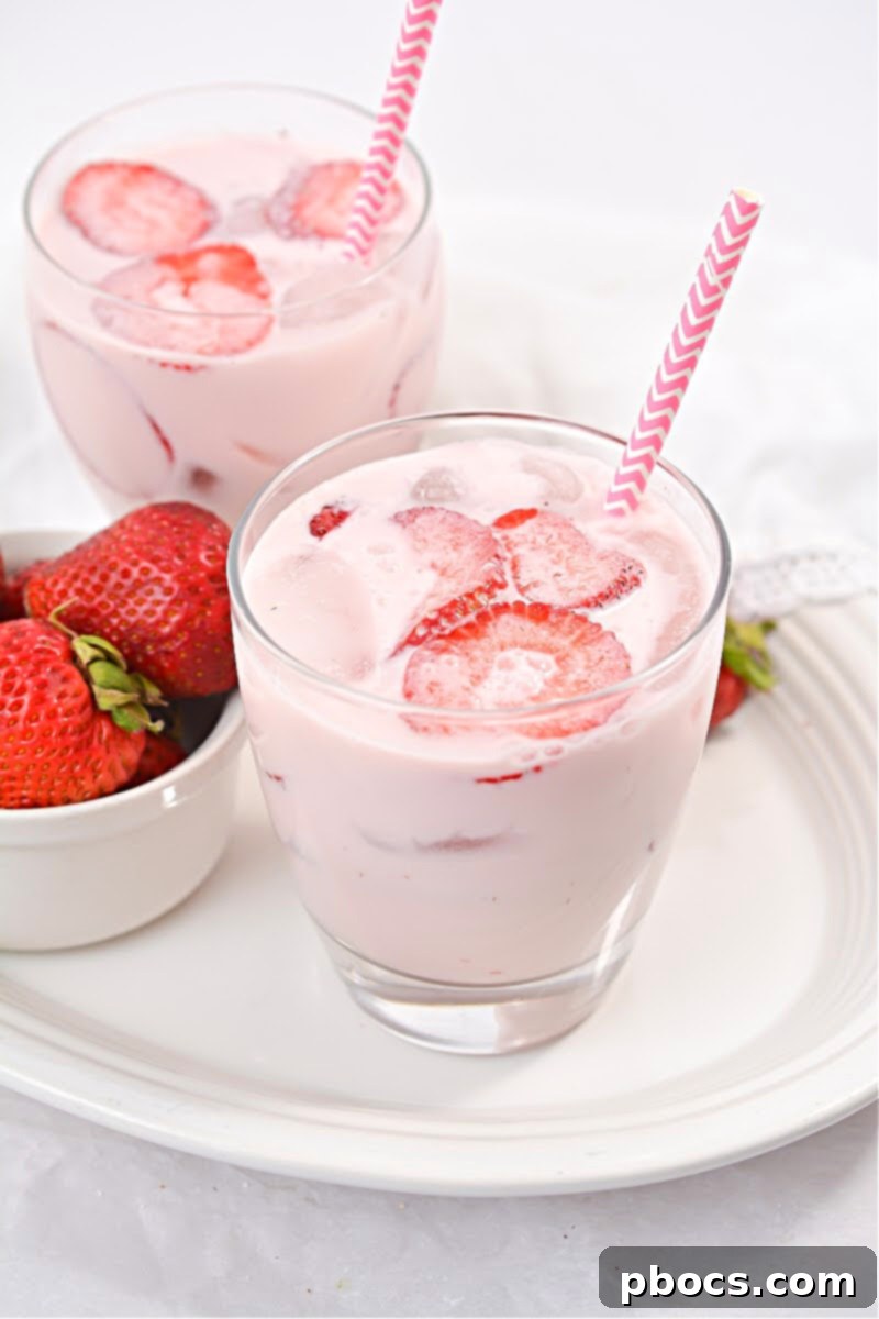 Step 4: Pouring the Keto Pink Drink mixture into glasses.
