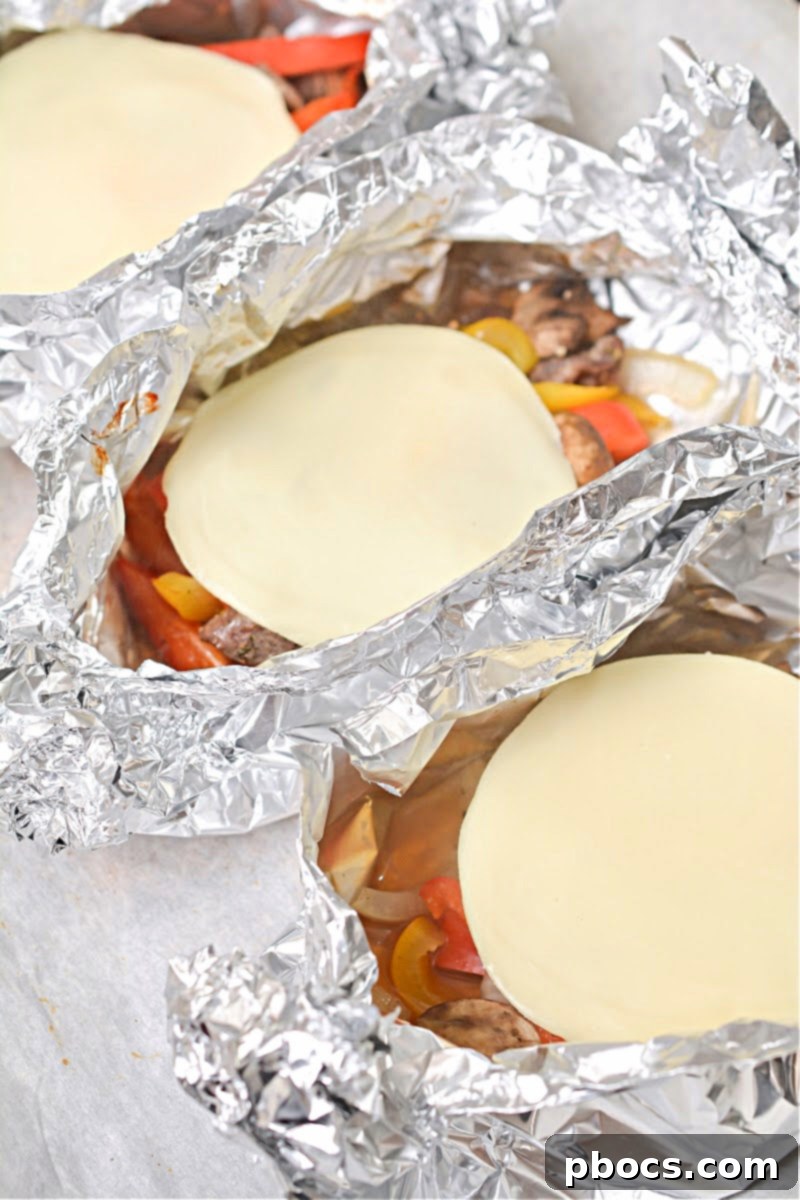 Melted cheese on Keto Philly Cheesesteak Foil Packets