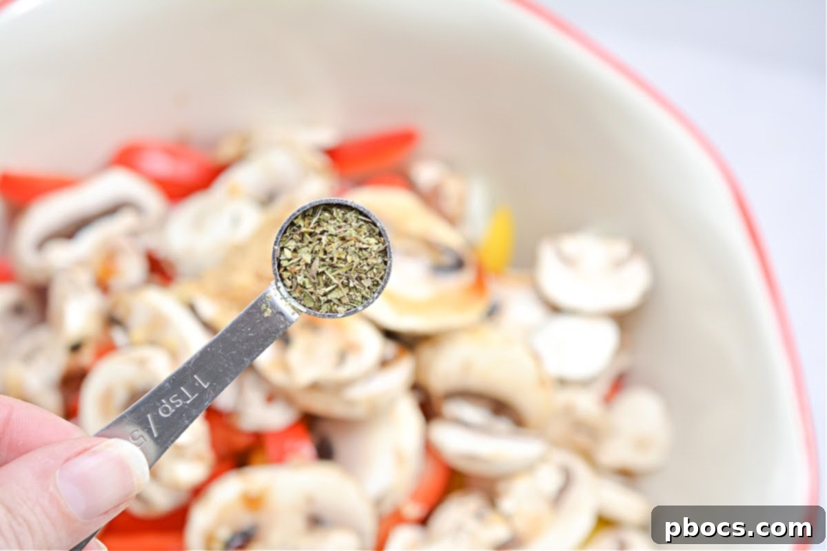 Dividing mixture into foil pieces for Keto Philly Cheesesteak Foil Packets