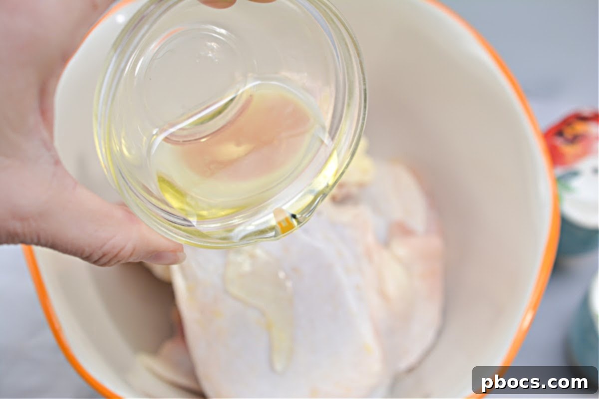 Drizzling Olive Oil on Chicken Thighs