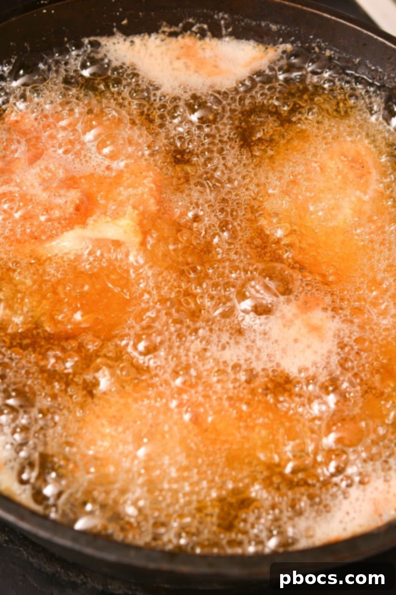 Step 7: Frying keto fried chicken in hot oil