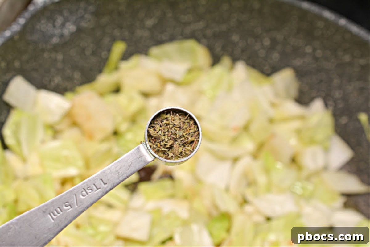 Keto Butter Fried Cabbage With Ground Sausage - Adding Cabbage