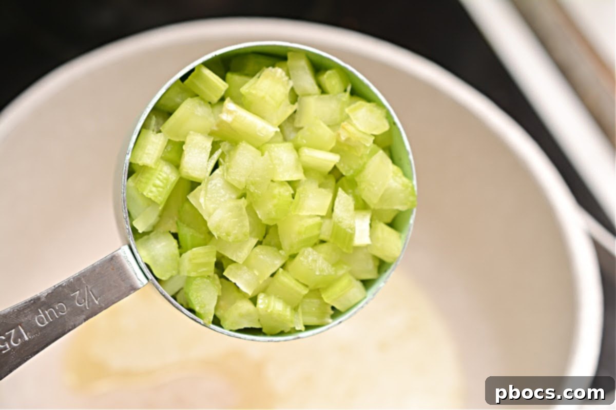 Butter melting in a saucepan over medium heat, preparing for soup base.