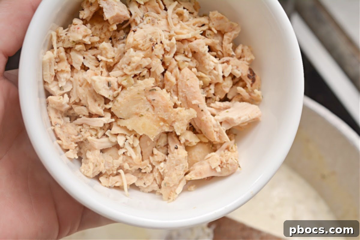 The soup simmering and thickening in the saucepan.