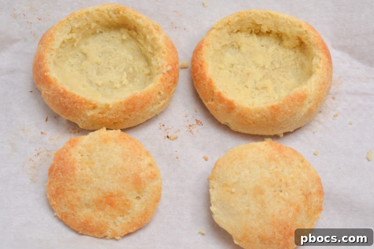 Cooked chicken breast added to the thickened soup, simmering gently.