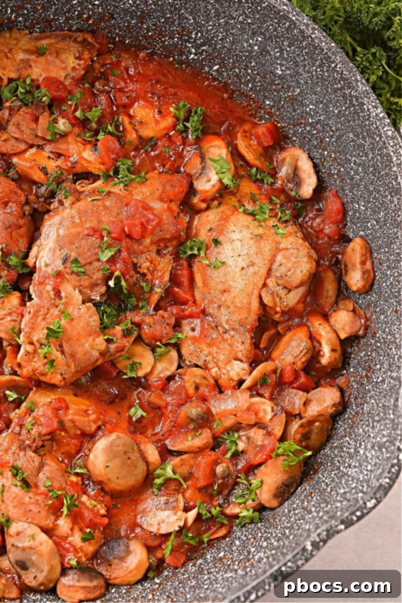 Keto Chicken Cacciatore served with fresh herbs