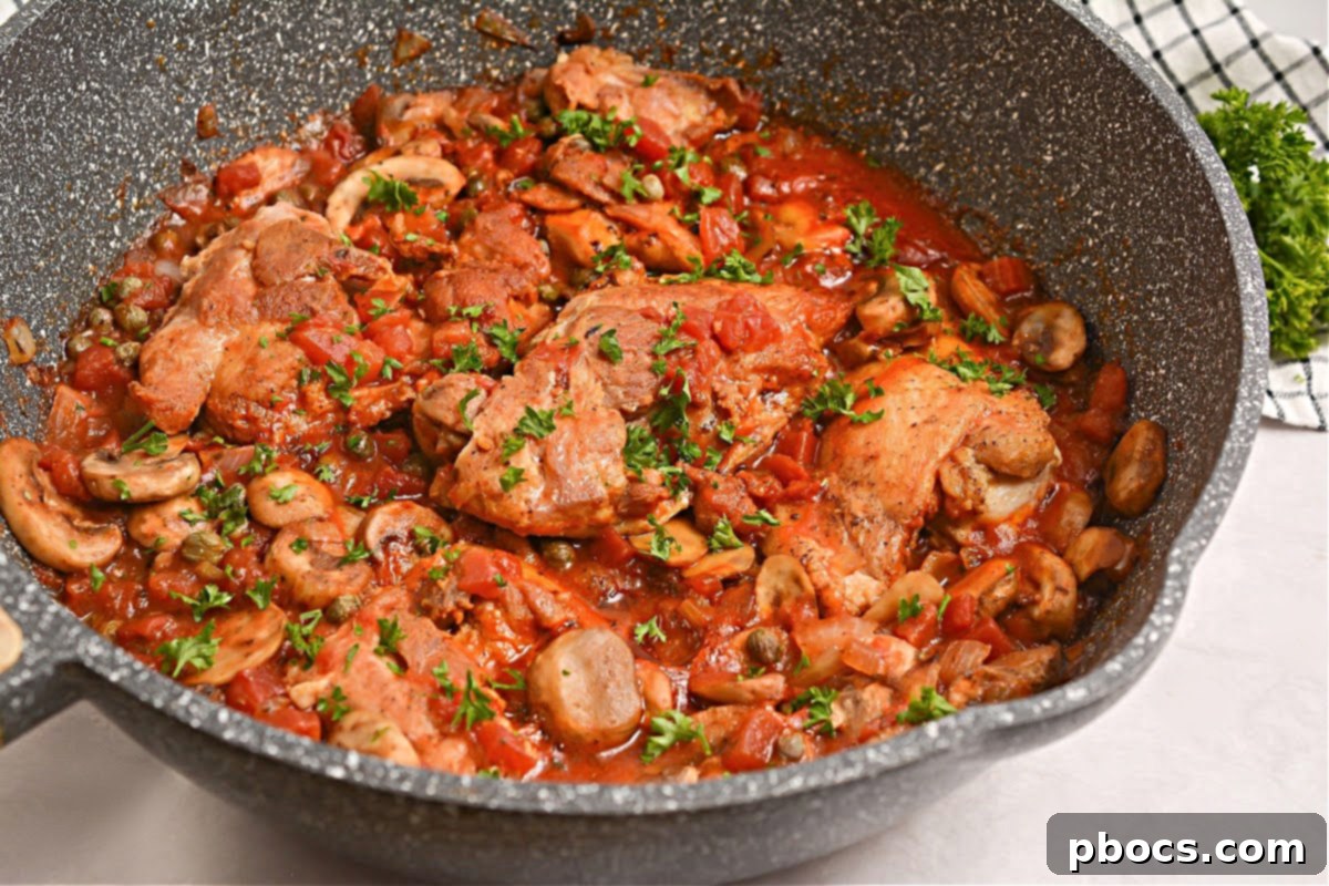 Adding chicken and capers to the sauce