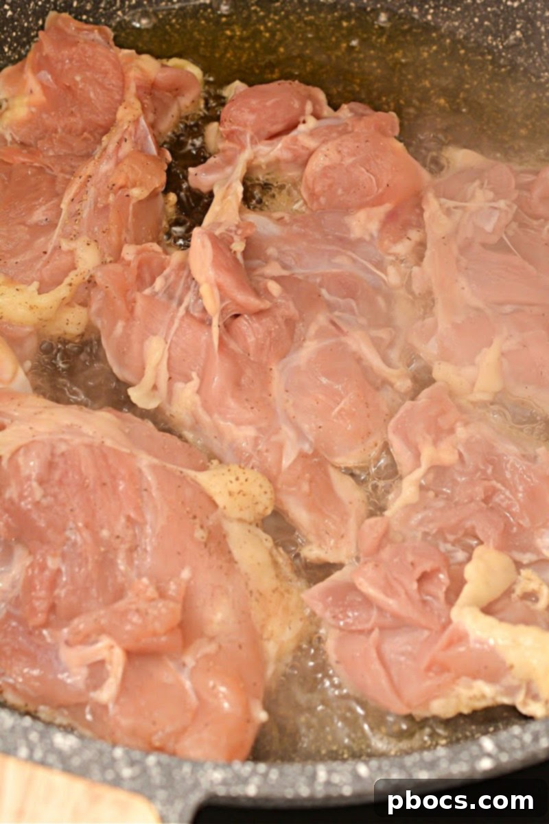 Heating oil in a skillet for Keto Chicken Cacciatore