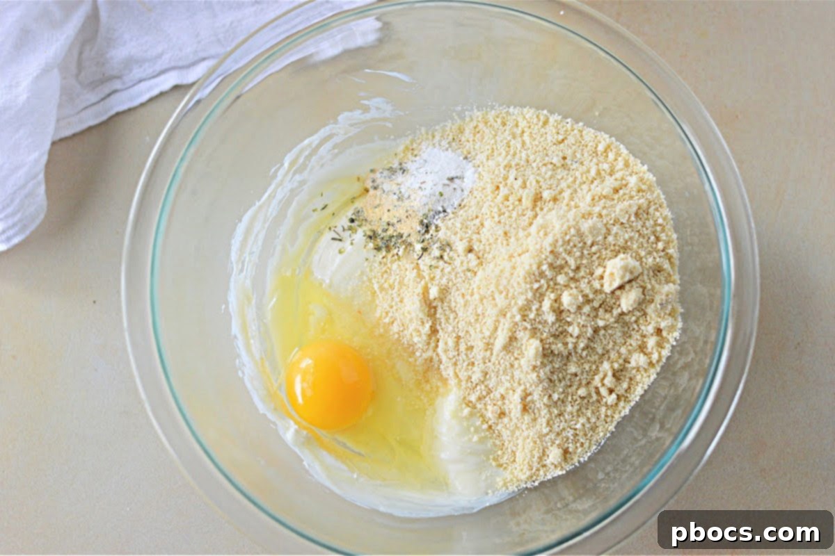 Keto Italian Deli Bake 11 Layering ham in the baking dish