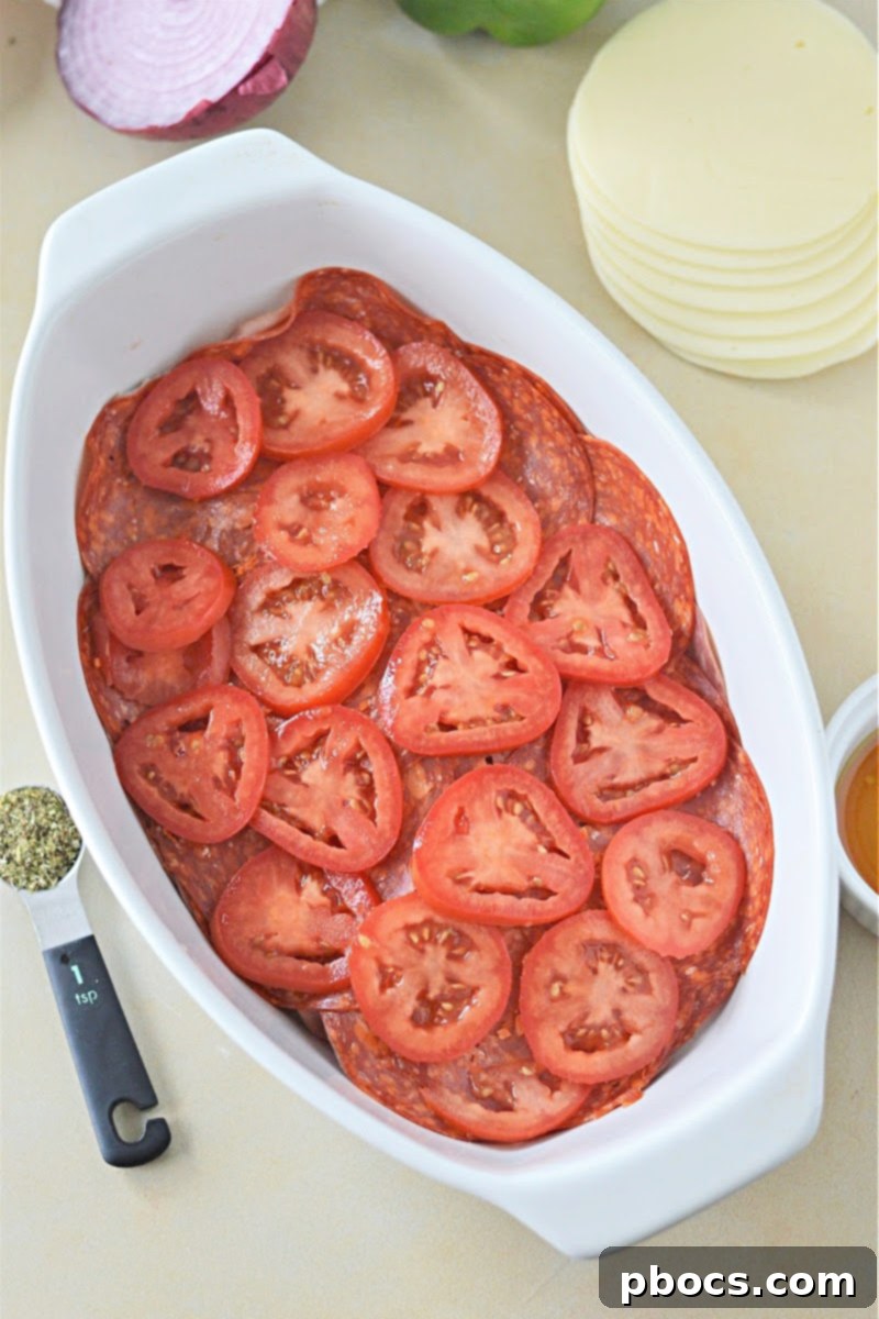 Keto Italian Deli Bake 15 Adding bell peppers, onions, and pepperoncini