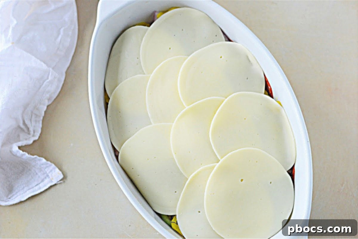 Keto Italian Deli Bake 17 Layering provolone cheese slices on top