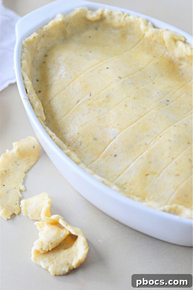 Keto Italian Deli Bake 18 Rolling out fathead dough between parchment paper