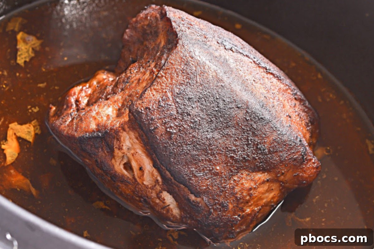 Pork shoulder transferred to the slow cooker