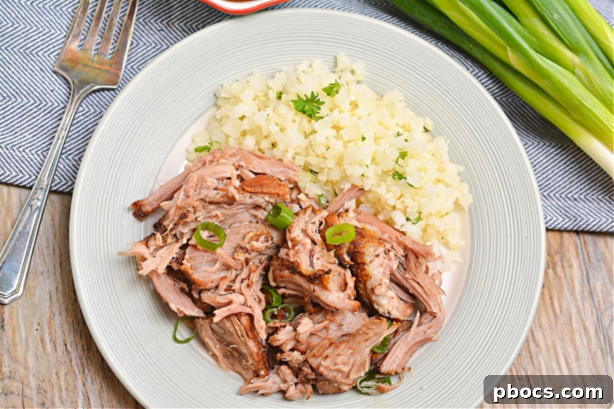 Keto slow cooker pork shoulder served with delicious sides