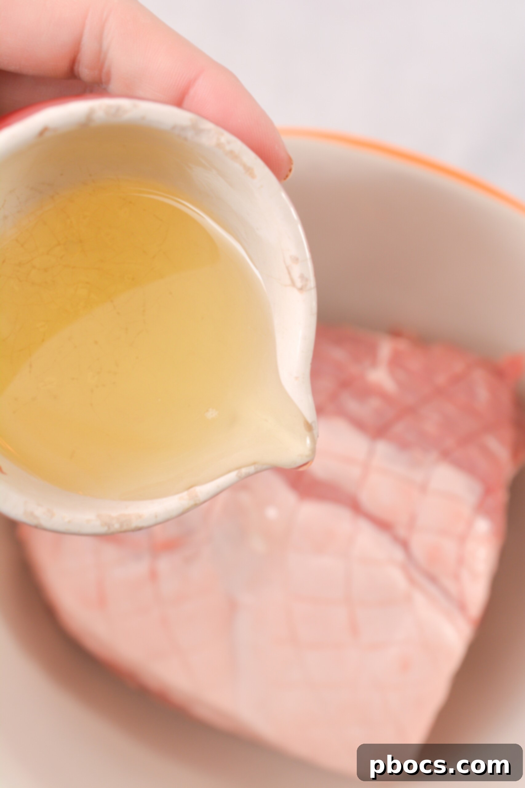 Applying the rub to the pork shoulder