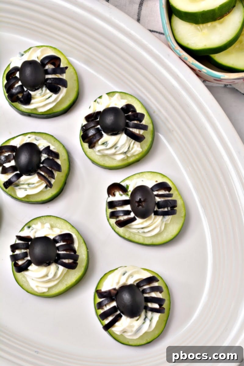Keto Cucumber Web Bites 2 Keto Spider Cucumber Appetizer Bites on a festive platter for Halloween