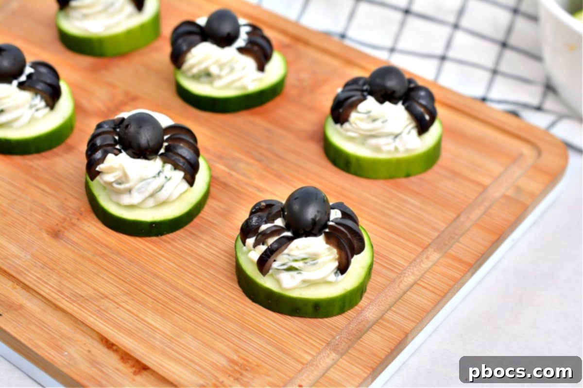 Keto Cucumber Web Bites 14 Step 7: Slicing black olives to create the spider legs