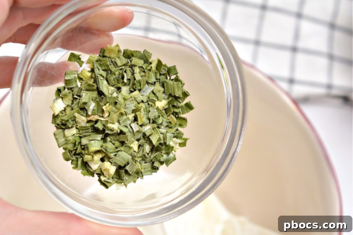 Keto Cucumber Web Bites 8 Step 1: Mixing cream cheese, sour cream, and spices in a bowl