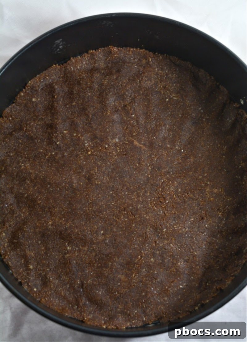 Keto Pumpkin Spice Mousse Cake 9 Step 2: Pressing crust into springform pan
