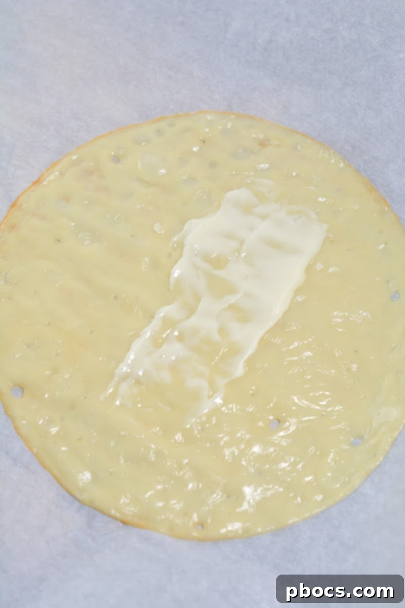 Keto Club Pinwheels 10 Keto Club Sandwich Roll Ups - Adding turkey slices to the wrap.