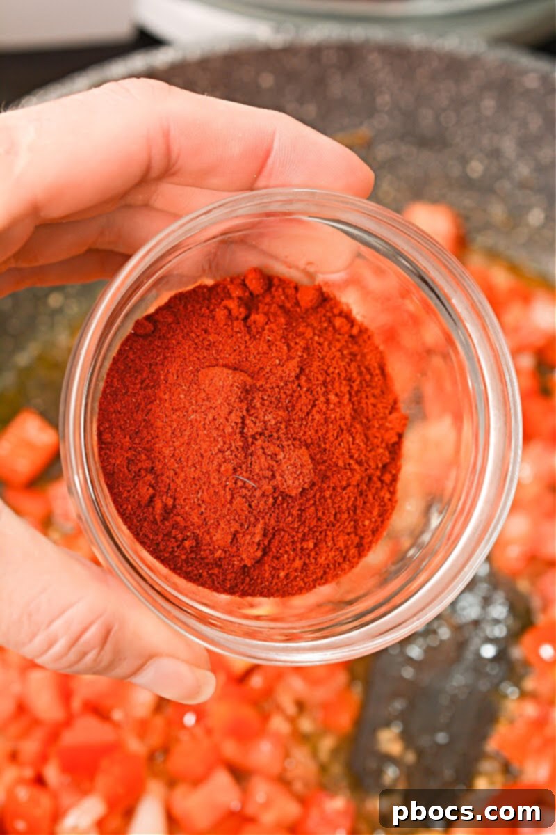 Adding Tomatoes and Garlic