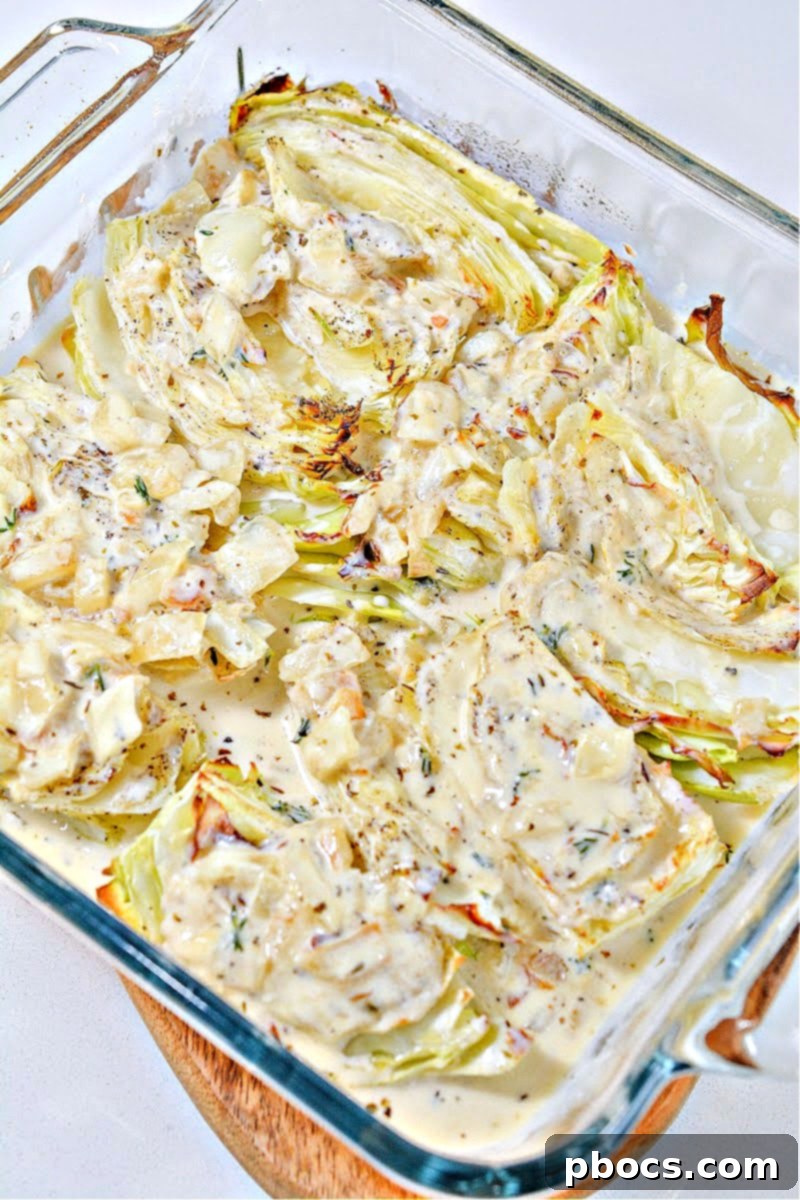 Keto Cabbage Au Gratin topped with shredded cheese before broiling