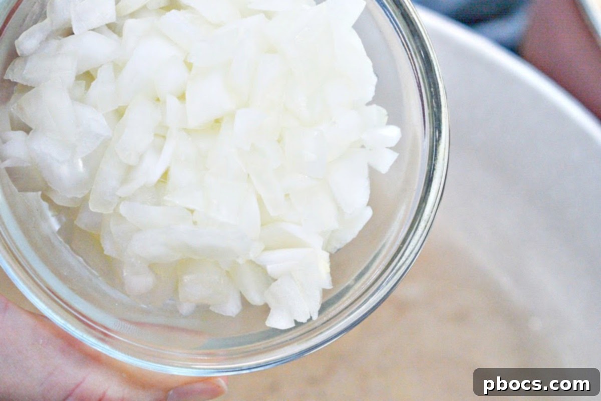 Onions sauteing in butter in a skillet