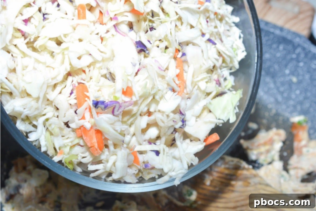 Cream cheese melting into the chicken mixture in the skillet.
