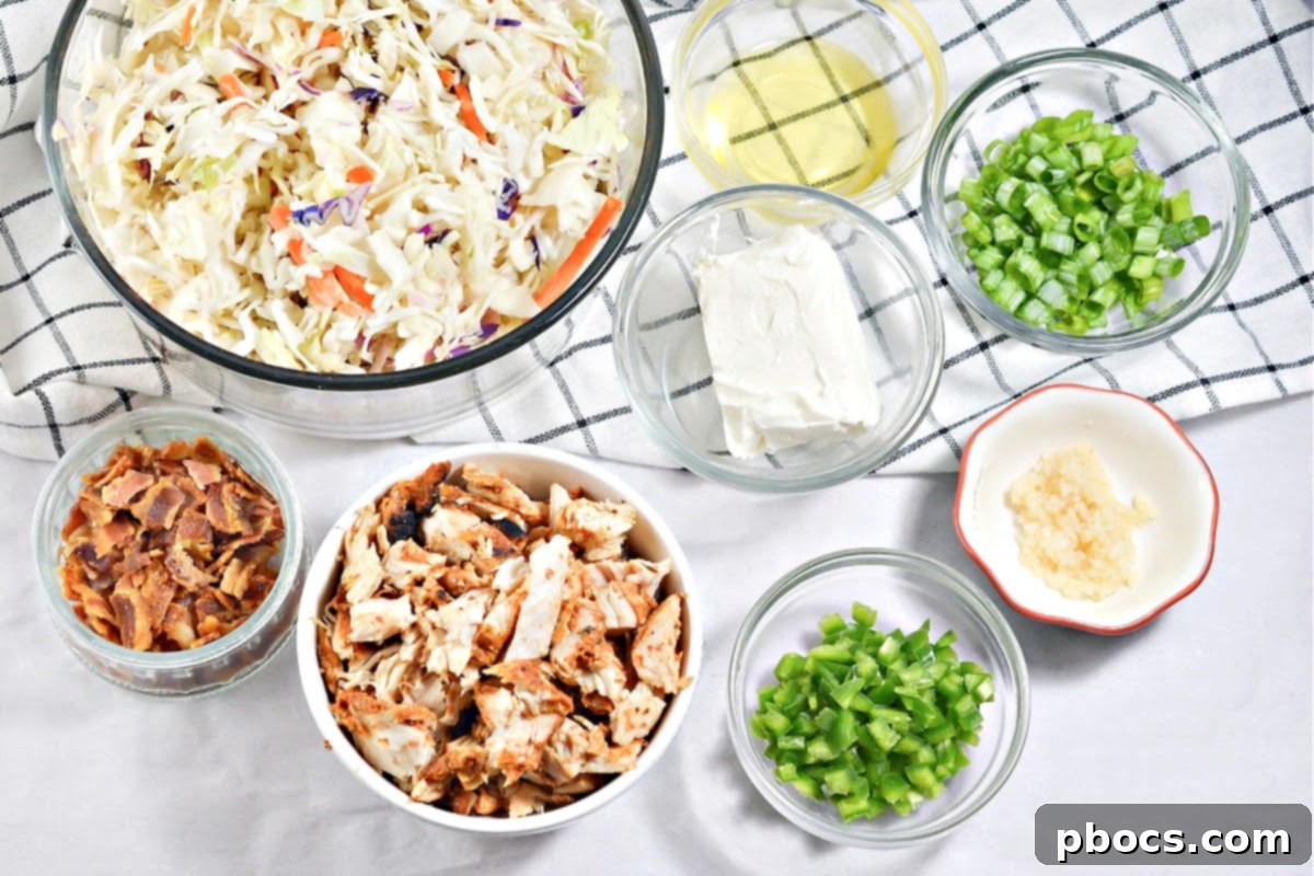 Overhead view of Keto Crack Slaw with a serving spoon, highlighting the vibrant ingredients.