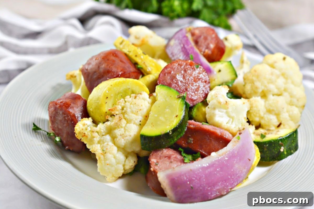 Low-Carb Sheet Pan Sausage and Veggies - Close-up of seasoned sausage and vegetables