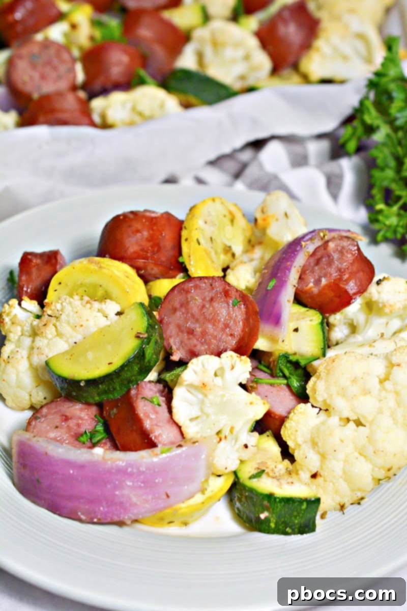 Low-Carb Sheet Pan Sausage and Veggies - Meal prepped portions in containers