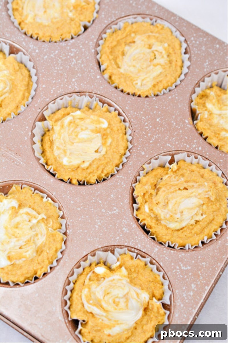 Keto Pumpkin Muffins with Cream Cheese Swirl 12 Swirling cream cheese into the pumpkin muffin batter
