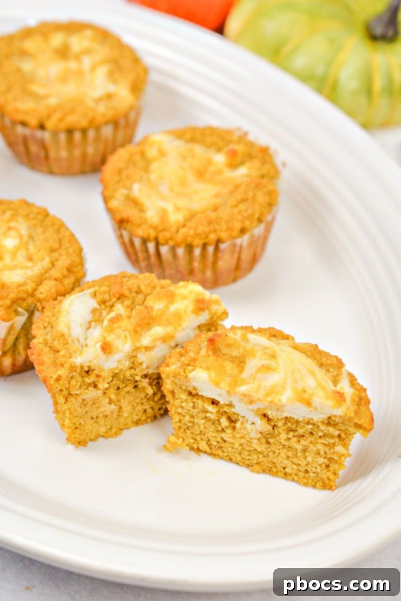 Keto Pumpkin Muffins with Cream Cheese Swirl 3 Close-up of fluffy Keto Pumpkin Cream Cheese Swirl Muffins