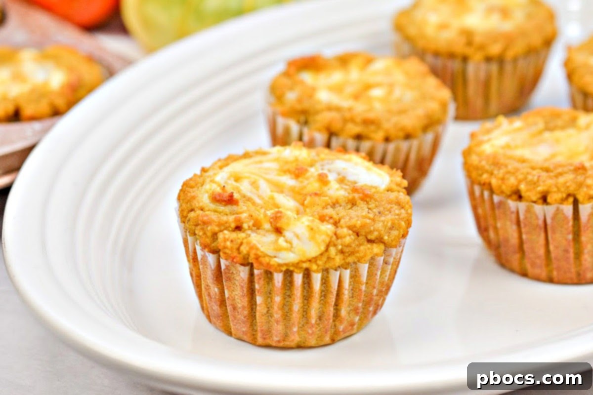 Keto Pumpkin Muffins with Cream Cheese Swirl 5 Ingredients for Keto Pumpkin Cream Cheese Swirl Muffins laid out on a kitchen counter