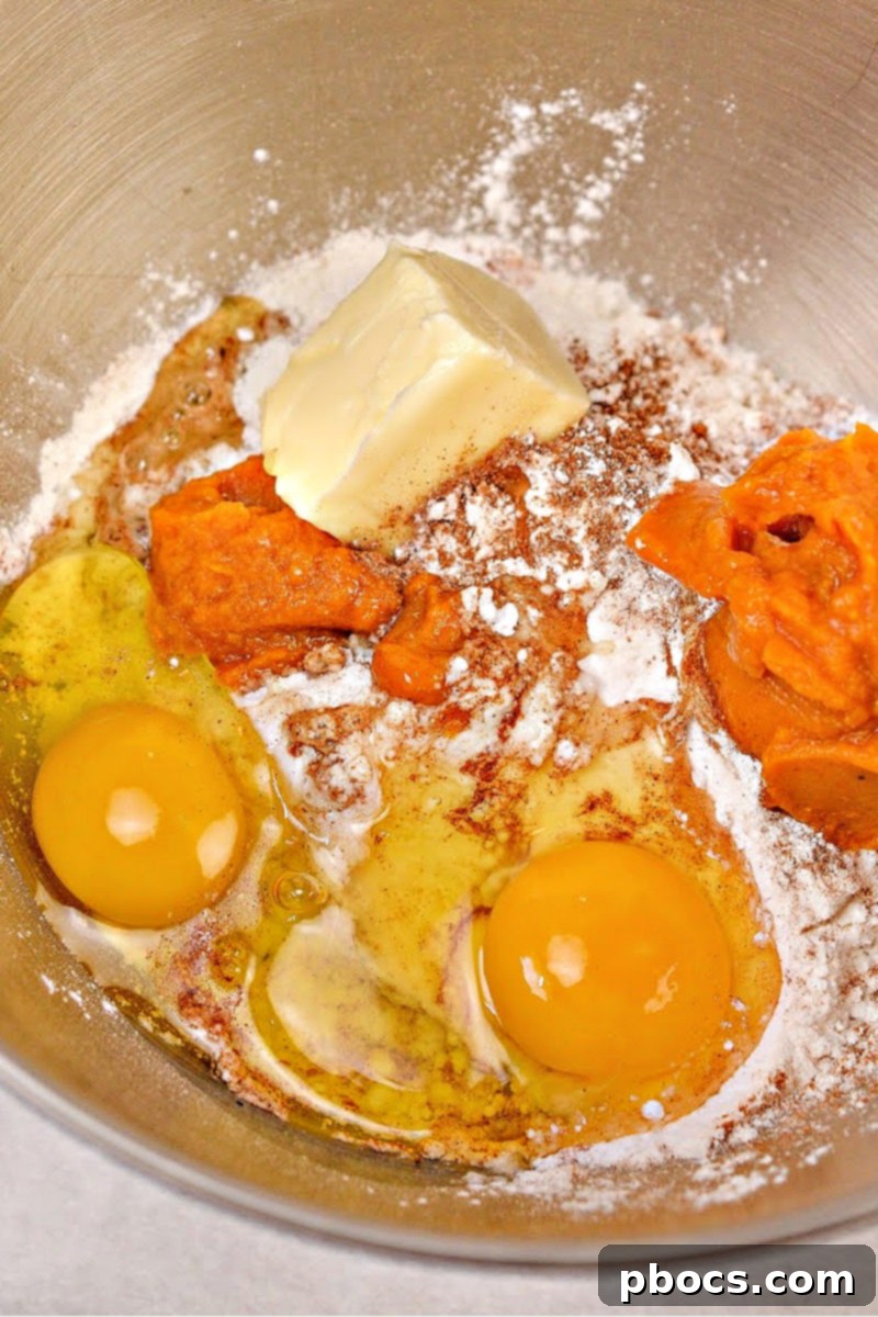 Keto Pumpkin Muffins with Cream Cheese Swirl 8 Lining a muffin tin with cupcake liners for baking