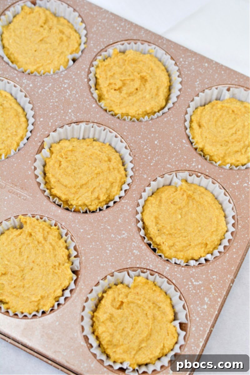 Keto Pumpkin Muffins with Cream Cheese Swirl 9 Mixing the muffin batter for Keto Pumpkin Cream Cheese Swirl Muffins
