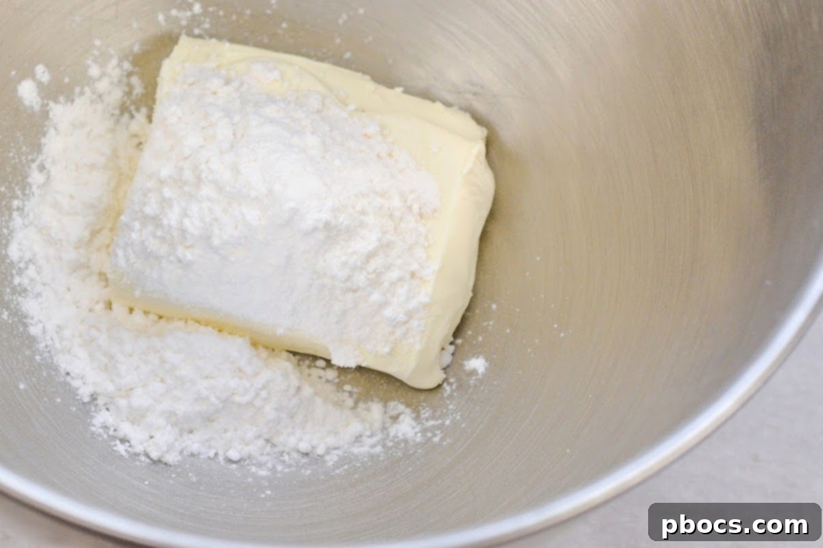 Keto Pumpkin Muffins with Cream Cheese Swirl 10 Filling cupcake liners with pumpkin muffin batter