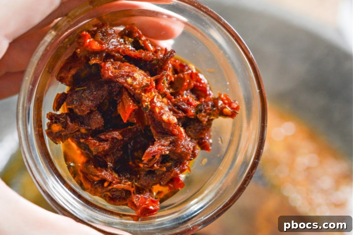 Creamy Tomato Basil Keto Chicken Skillet 13 Chicken broth poured into the skillet to deglaze