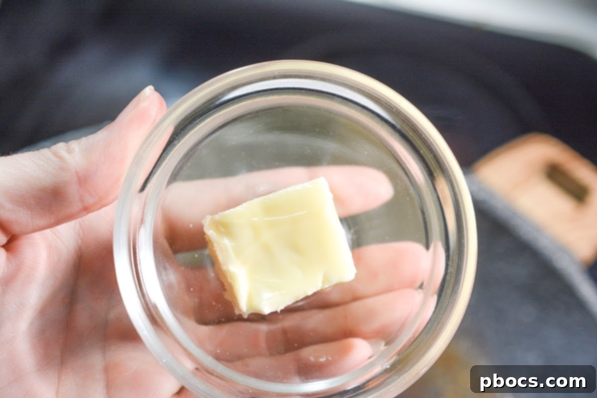 Creamy Tomato Basil Keto Chicken Skillet 10 Chicken tenderloins searing in a hot skillet