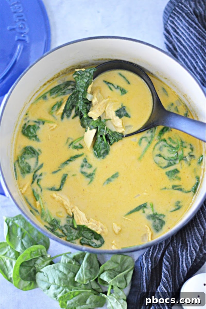 Meal prep containers with Creamy Keto Pumpkin Curry Soup for easy storage