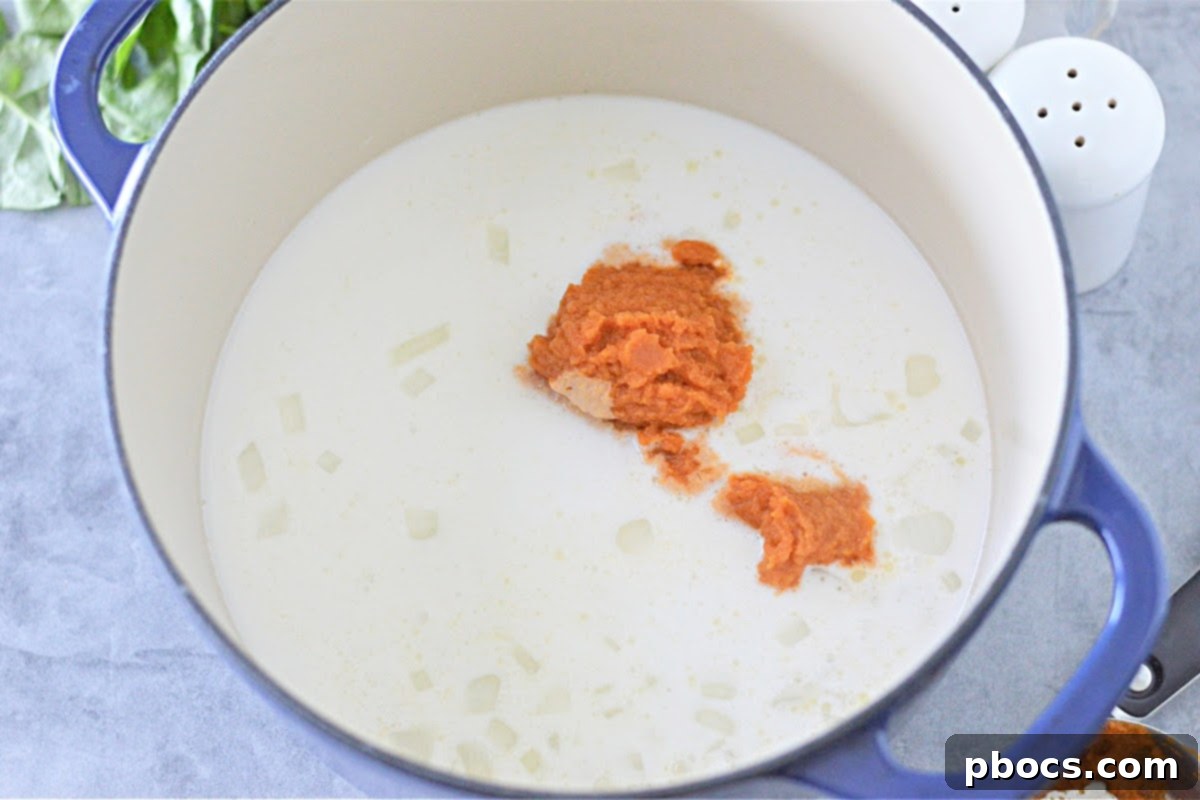 Sautéing onions in butter for creamy keto pumpkin curry soup