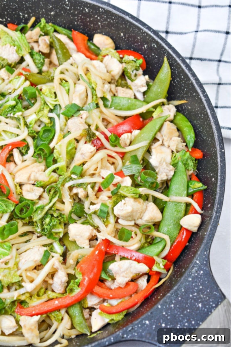 Finished Low Carb Chicken Chow Mein stir-frying in a skillet.