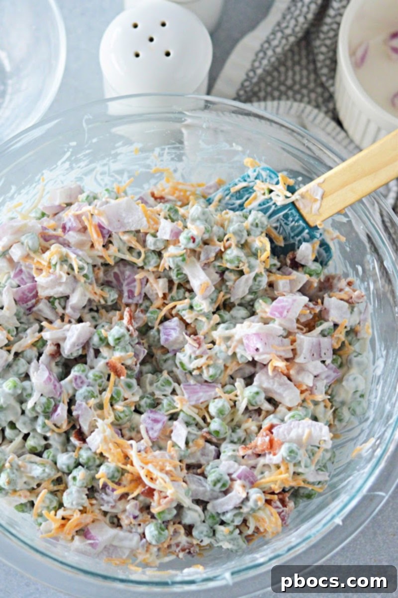 Keto-Friendly Pea Salad Delight 10 Seasoning the low-carb pea salad with salt and pepper.