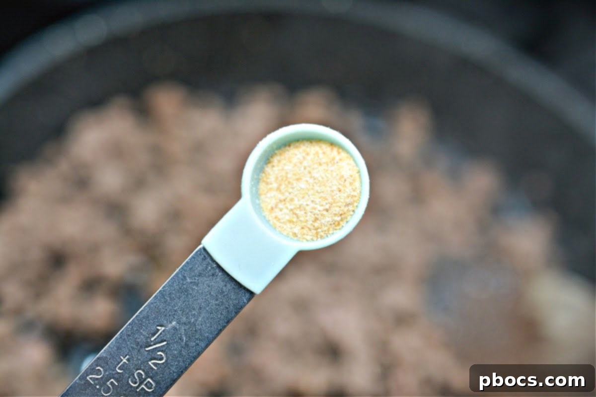 Seasoning cooked ground beef