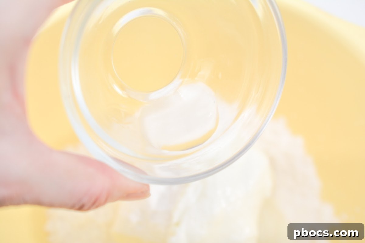 Mixing cream cheese, yogurt, Swerve, peppermint extract, and gelatin