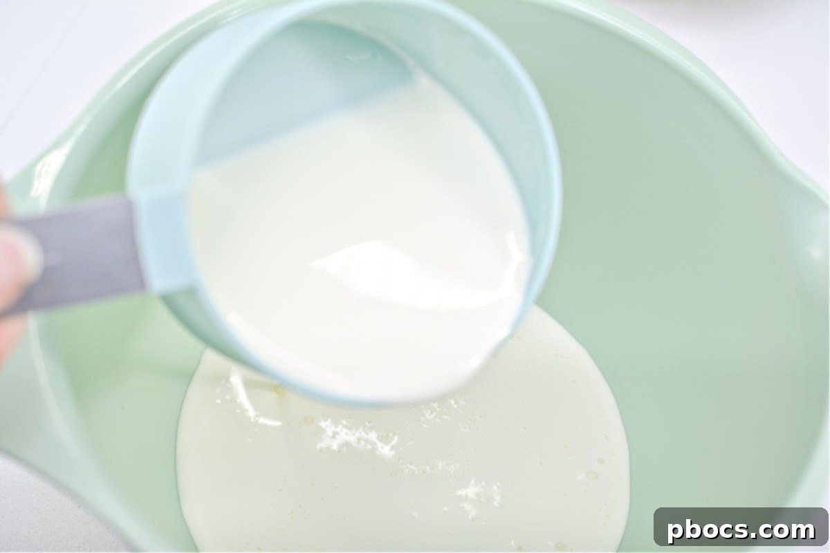 Folding whipped cream into the cheesecake mixture