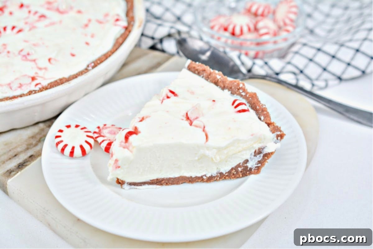 Close-up of a slice of no-bake Keto Candy Cane Cheesecake