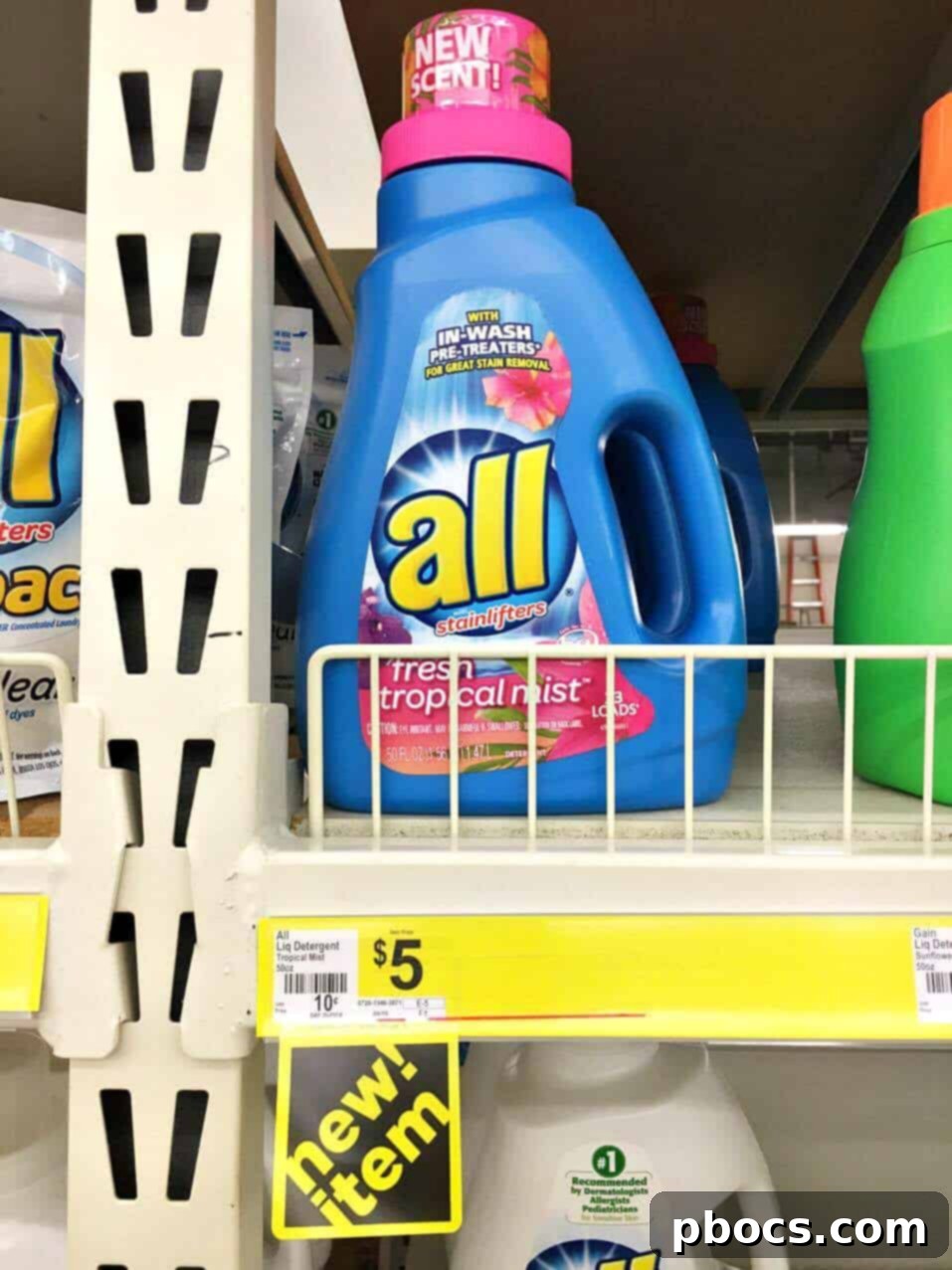 A bottle of all Fresh Tropical Mist laundry detergent, inspiring tropical home decor.